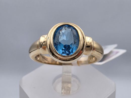 Gold ring with topaz
