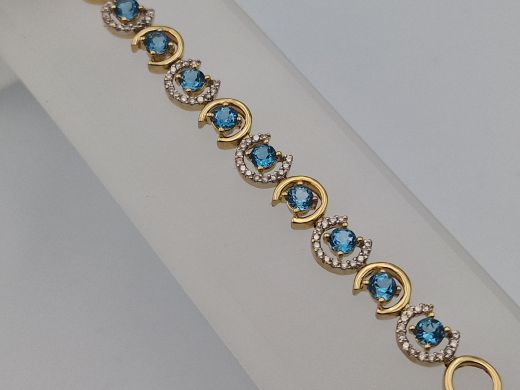 Zelta rokassprādze ar briljantu un topāzu, 11.22 g, izm. 18