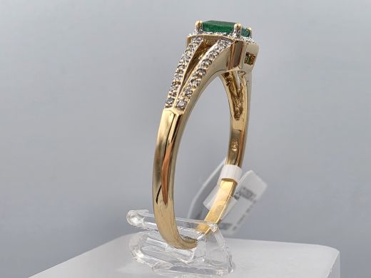 Gold ring with diamonds and emeralds