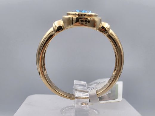 Gold ring with topaz