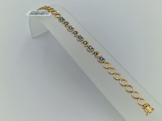 Zelta rokassprādze ar briljantu un topāzu, 11.22 g, izm. 18